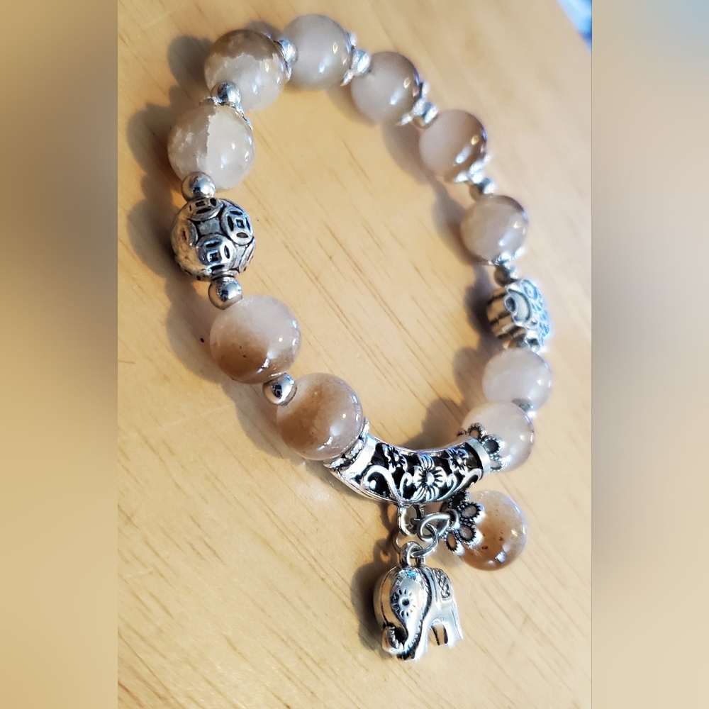 Smokey Quartz Beaded Bracelet Adorning A Silvertone Elephant.